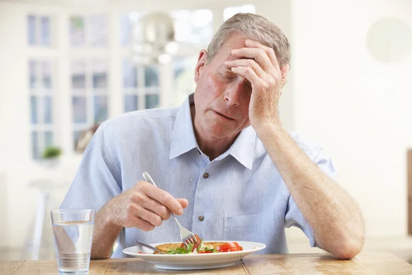Sick man trying to eat — Stock Photo, Image