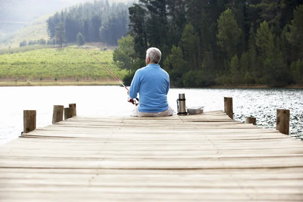 Senior man fishing — Stock Photo, Image