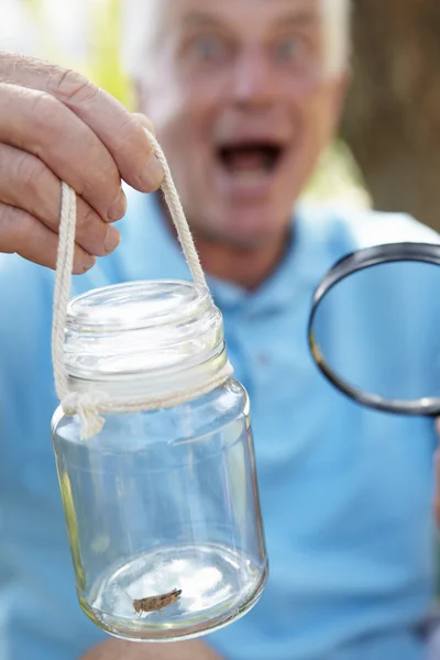 Senior man with cricket — Stock Photo, Image