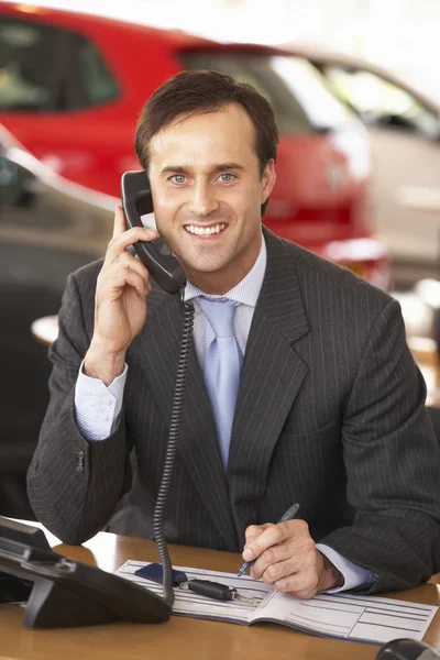 Man in car showroom — Stock Photo, Image