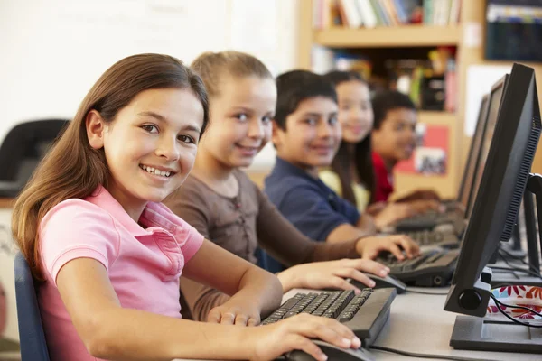 Schoolchildren with computers — Stock Photo, Image