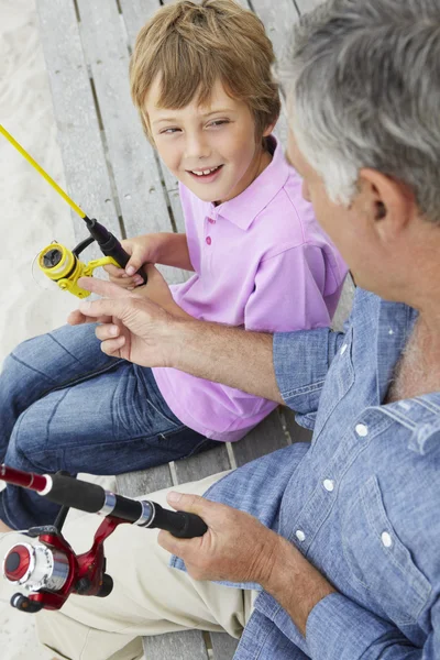 Man fishing with grandson — Stock Photo, Image