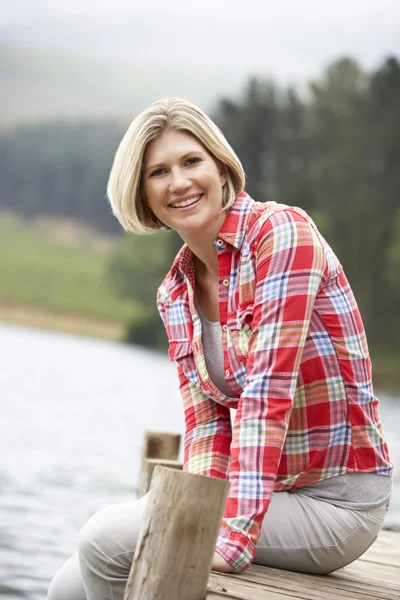 Woman on a jetty — Stock Photo, Image