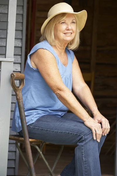 Senior woman on veranda — Stock Photo, Image