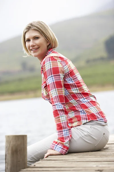 Woman on a jetty — Stock Photo, Image