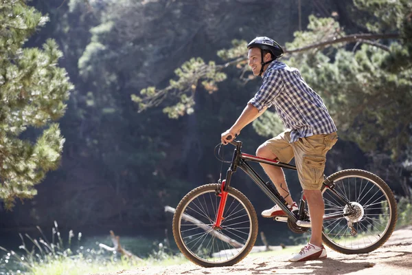 Man on bike ride — Stock Photo, Image