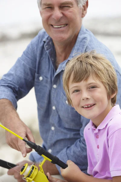 Man fishing with grandson — Stock Photo, Image