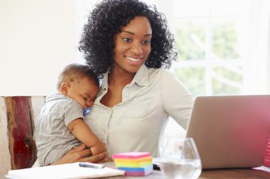 Mother With Baby Working clipart