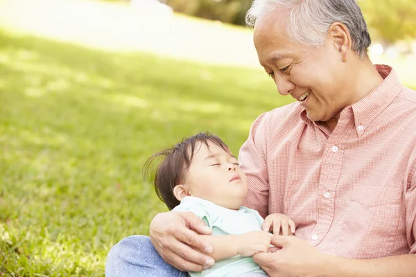 Grandfather Holding Sleeping Grandson — Stock Photo, Image