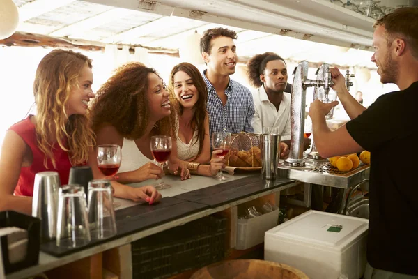 Friends Enjoying Drink At Bar — Stock Image Friends Enjoying Drink At Bar Stock Photo