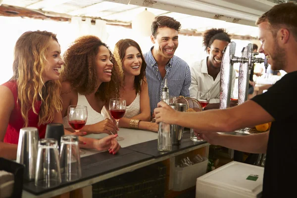 Friends Enjoying Drink At Bar — Stock Image Friends Enjoying Drink At Bar Stock Photo