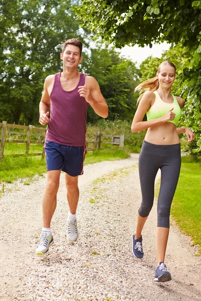 Couple On Run In Countryside — Stock Photo, Image