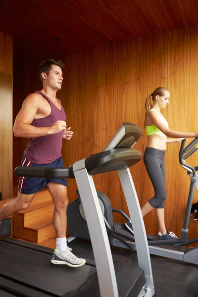 Couple Exercising In Home Gym — Stock Photo, Image