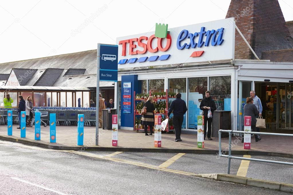 Oxfordshire, UK - 2014: Exterior view of Tesco supermarket entrance from car park.