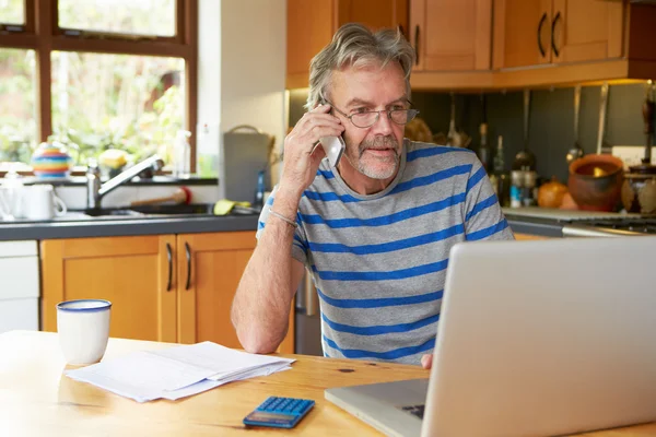 Mature Man  Looking At Home Finances — Stock Photo, Image