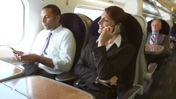 Businesspeople On Train Using Digital Devices — Stock Video