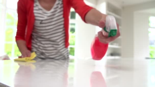 Woman Cleaning Surface In Kitchen — Stock Video