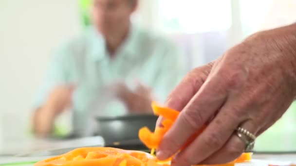 Woman Chopping Peppers And Adding To Frying Pan — Stock Video