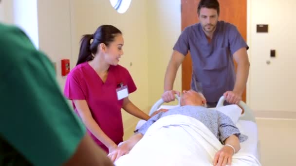 Patient Being Wheeled Along Corridor — Stock Video