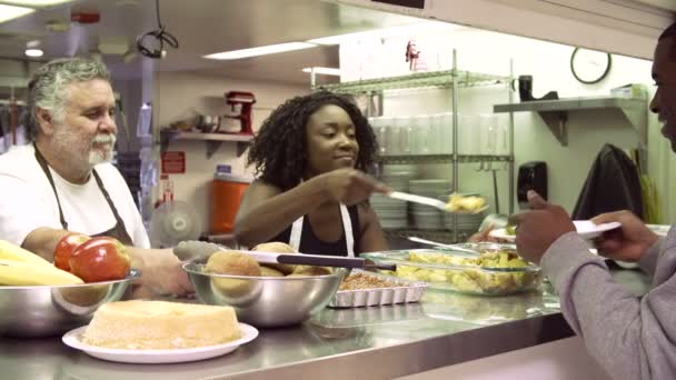 Young Woman Serving Food — Stock Video