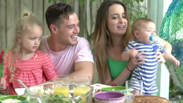 Family Enjoying Outdoor Meal At Home — Stock Video