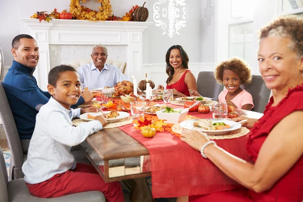 Family Enjoying Thanksgiving Meal At Table Stock Picture