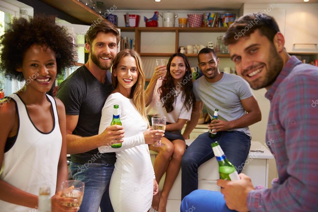 Friends Enjoying Drinks At Home — Stock Photo © monkeybusiness 98178594
