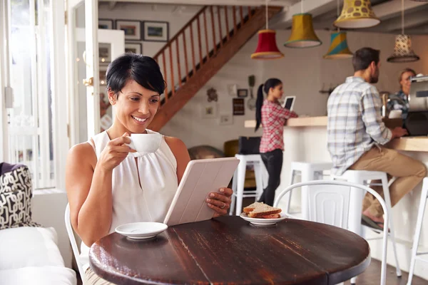 Middle aged woman in a cafe — Stock Photo, Image