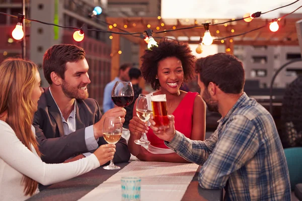 Group of friends at rooftop party — Stock Photo, Image