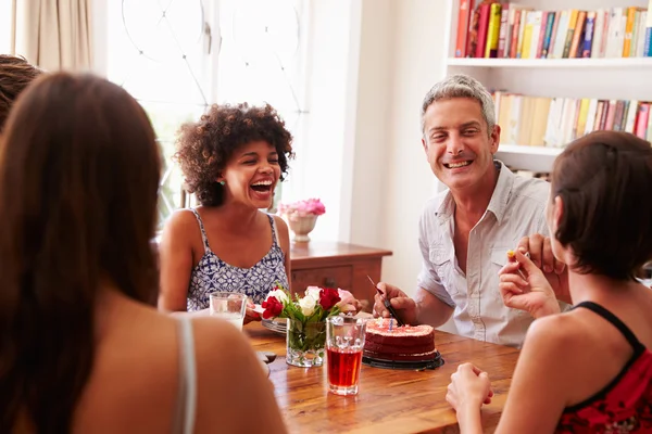 Friends sitting at a dining table l — Stock Photo, Image