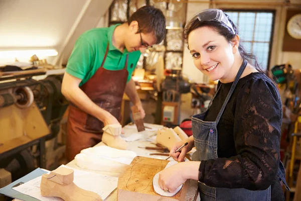 Shoemakers preparing shoe lasts in a workshop — Stock Photo, Image