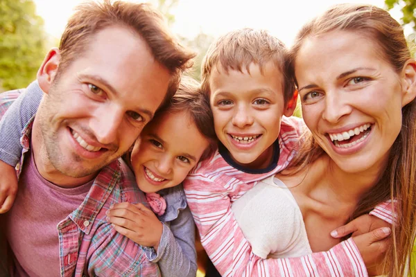Young kids hugging parents Stock Image