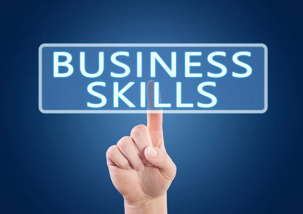 Business Skills - ручное нажатие кнопки на интерфейсе на синем фоне . — стоковое фото