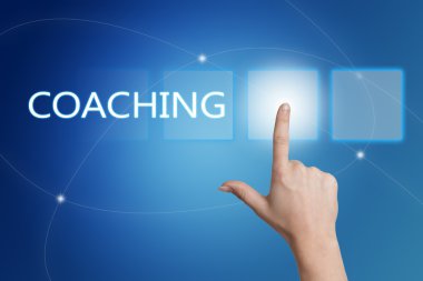 Coaching - hand pressing button on interface with blue background.