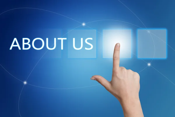 About us - hand pressing button on interface with blue background. — Stok fotoğraf