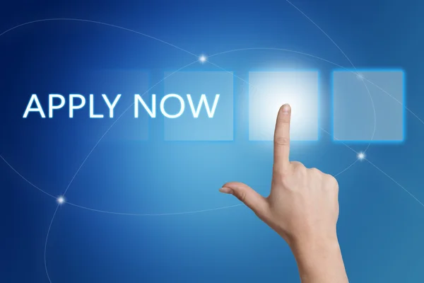 Apply now - hand pressing button on interface with blue background. — 图库照片