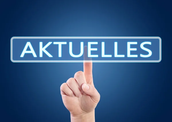 Aktuelles - german word for current, news, topically or updated - hand pressing button on interface with blue background. — Stock Fotó