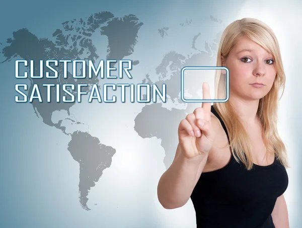 Young woman press digital Customer Satisfaction button on interface in front of her — Stockfoto