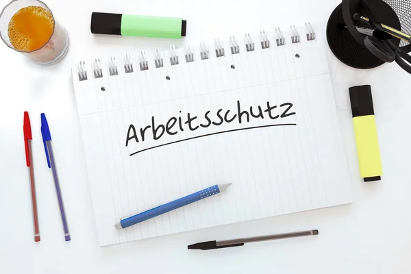 Arbeitsschutz - niemiecki wyraz dla bezpieczeństwa pracy - odręcznie tekst w notatniku na biurko - 3d render ilustracja. — Zdjęcie stockowe