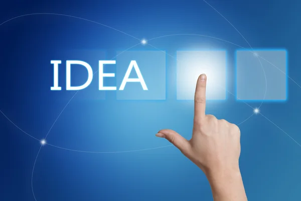 Idea - hand pressing button on interface with blue background. — 图库照片