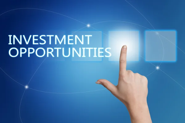 Investment Opportunities - hand pressing button on interface with blue background. — Stock fotografie