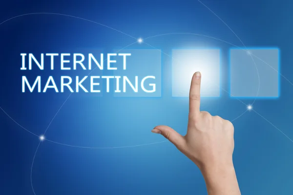 Internet Marketing - hand pressing button on interface with blue background. — Stok fotoğraf