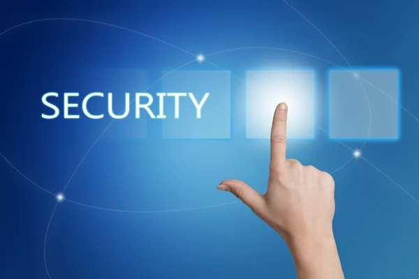 Security - hand pressing button on interface with blue background. — Stock fotografie