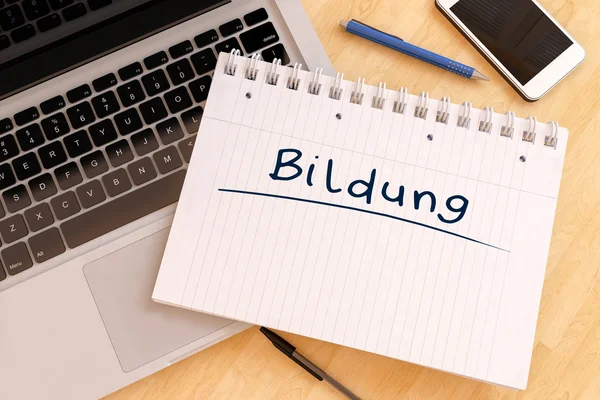 Bildung - palavra alemã para educação - texto manuscrito em um caderno em uma mesa - ilustração de renderização 3d . — Fotografia de Stock