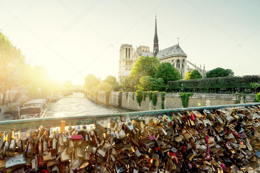 View of Notre Dame cathedral in Paris with famous locks of love