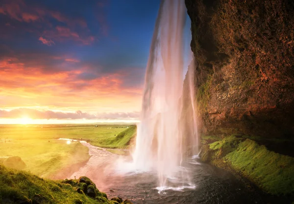 Wodospad Seljalandsfoss o zachodzie słońca, Islandia — Zdjęcie stockowe