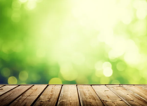 Wooden surface and sunny forest — Stock Photo, Image