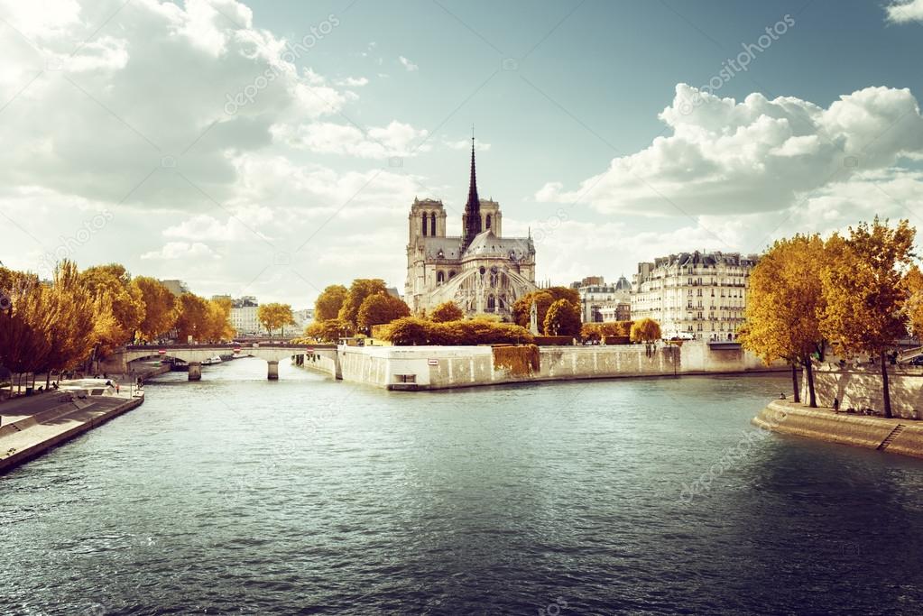 Notre Dame church in Paris and autumn sunny day
