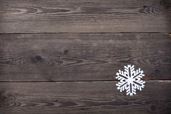 Christmas trä bakgrund med snöflingor — Stockfoto