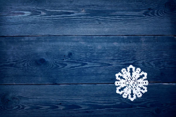 Christmas trä bakgrund med snöflingor — Stockfoto